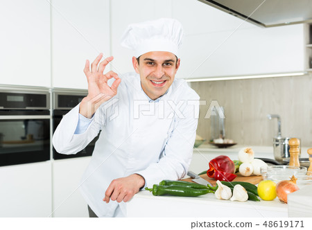 Portrait of the man proffesional who is posing in the kitchen 48619171