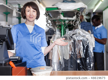Female administrator of laundry at reception Female administrator of laundry at reception 48619673