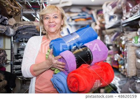 mature woman purchaser holding cotton plaids mature woman purchaser holding cotton plaids 48620159