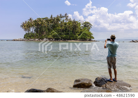 tourist man standing on the stone tourist man standing on the stone 48621590