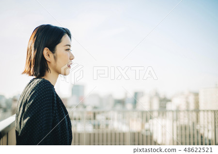 Woman rooftop portrait 48622521