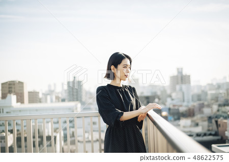 Women's rooftop lifestyle 48622575