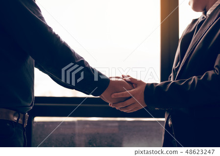 Business people compassionately holding hands 48623247