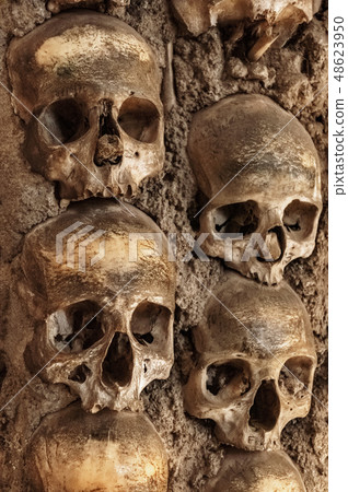 Skull and human bones. Cemetery ancient wall pattern. Horror dark chapel. Death pattern concept Skull and human bones. Cemetery ancient wall pattern. Horror dark chapel. Death pattern concept 48623950