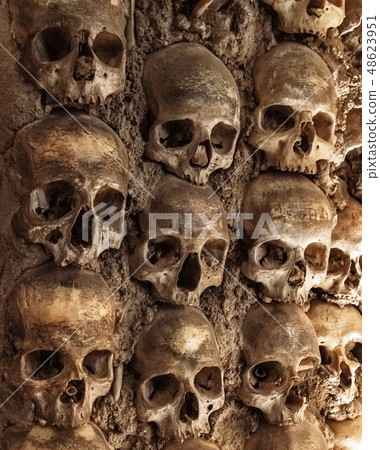 Skull and human bones. Cemetery ancient wall pattern. Horror dark chapel. Death pattern concept Skull and human bones. Cemetery ancient wall pattern. Horror dark chapel. Death pattern concept 48623951