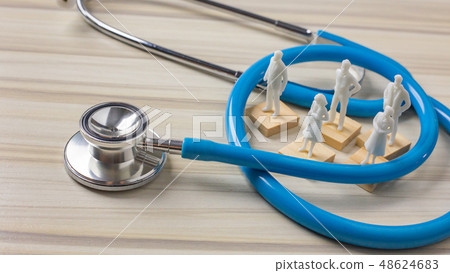 The stethoscopes on wood background  48624683