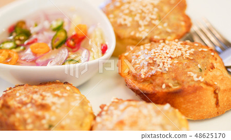 Toasted Baguette with minced pork spread dip sauce Toasted Baguette with minced pork spread dip sauce 48625170