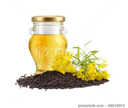 Rapeseed oil with seeds and flowers. Rapeseed oil with seeds and flowers. 48629953