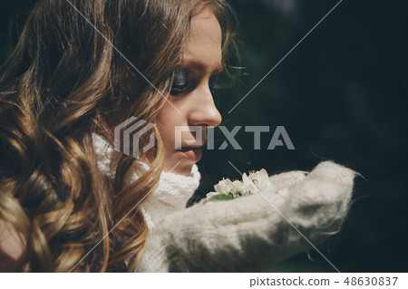girl with bright make-up in a warm scarf girl with bright make-up in a warm scarf 48630837