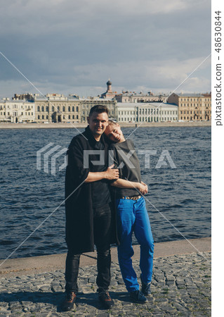 man hugs girl on background of waterfront  48630844