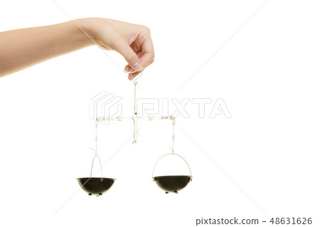 Law court. Female hand holds scales symbol of justice. Law court. Female hand holds scales symbol of justice. 48631626