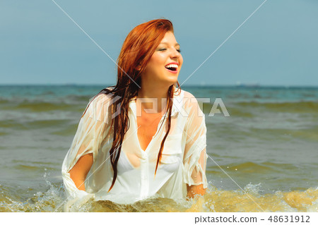 Vacation. Girl in water having fun on the sea. 48631912