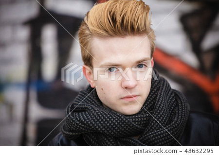 Fashion male portrait on graffiti wall Fashion male portrait on graffiti wall 48632295