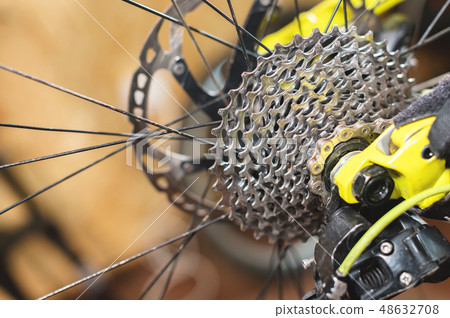 Close-up View of the bike in repair. Gear cassette close-up. Crafting service for mountain bikes Close-up View of the bike in repair. Gear cassette close-up. Crafting service for mountain bikes 48632708