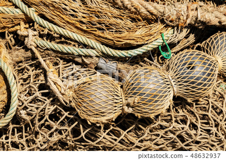 Old fishing nets with ropes and floats Full frame Old fishing nets with ropes and floats Full frame 48632937