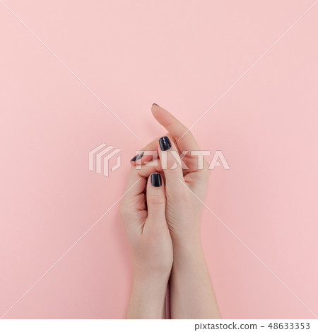 Woman's hands with black manicure Woman's hands with black manicure 48633353