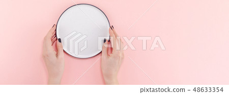 Empty plate in female hands mockup Empty plate in female hands mockup 48633354