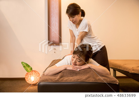 woman getting a massage woman getting a massage 48633699