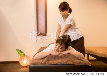 woman getting a massage woman getting a massage 48633701
