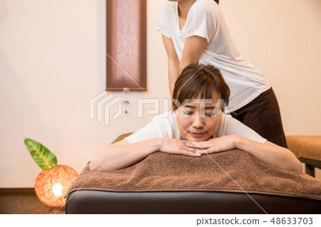 woman getting a massage woman getting a massage 48633703