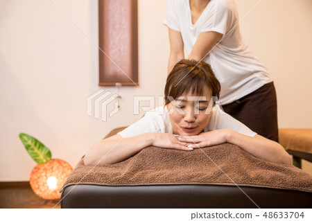 woman getting a massage woman getting a massage 48633704