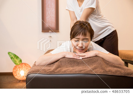 woman getting a massage woman getting a massage 48633705