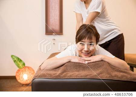 woman getting a massage woman getting a massage 48633706
