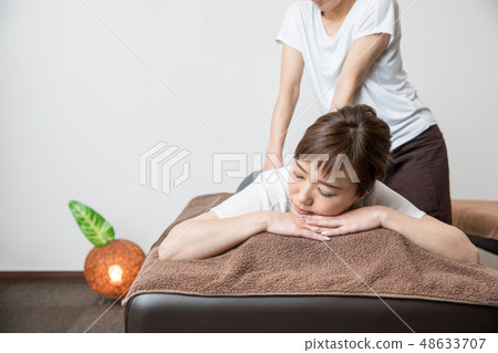 woman getting a massage woman getting a massage 48633707