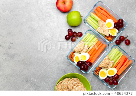 Lunch boxes with healthy snacks, overhead view 48634372