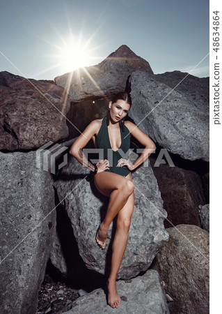 Beautiful girl in a swimsuit is posing at the Beautiful girl in a swimsuit is posing at the 48634864