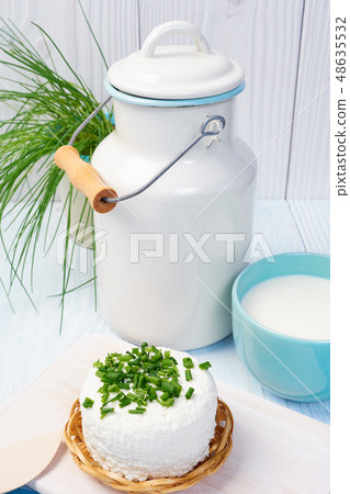 mug with milk on vintage table 48635532