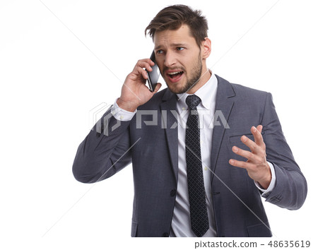 Businessman nervously talking on the phone 48635619
