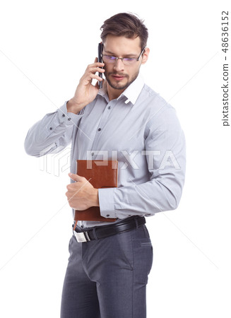 Young man talking on mobilephone. Young man talking on mobilephone. 48636152