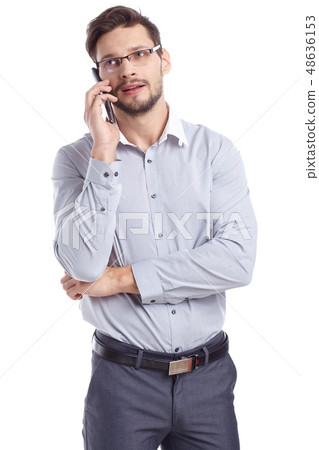 Young man talking on mobilephone. Young man talking on mobilephone. 48636153
