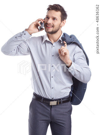 Young man talking on mobilephone. Young man talking on mobilephone. 48636162