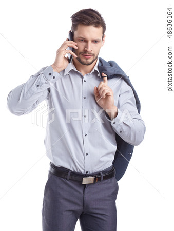 Young man talking on mobilephone. Young man talking on mobilephone. 48636164