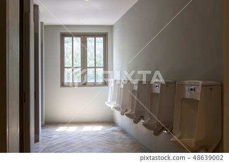 Empty public men toilet 48639002