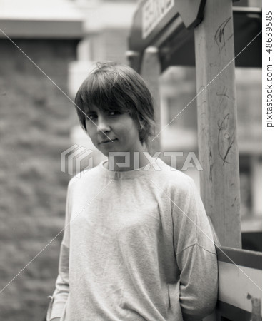 White girl looking at camera and smiling 48639585