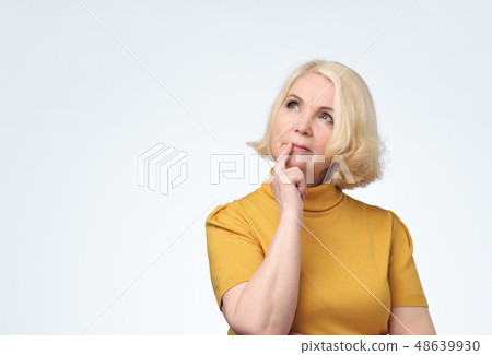 Senior woman looking confident up with smile Senior woman looking confident up with smile 48639930