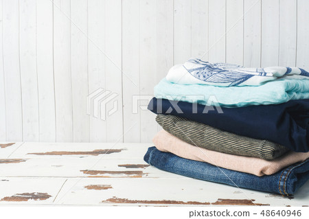 A stack of women's clothing on white boards A stack of women's clothing on white boards 48640946