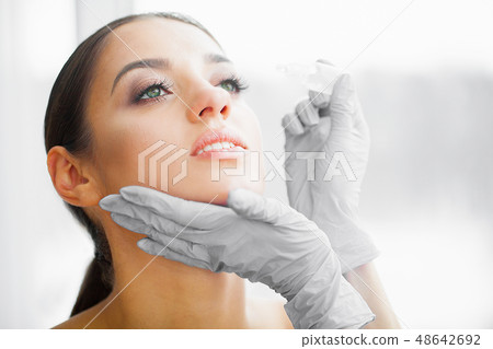 Health and Beauty. Eye Care. Beautiful Young Woman Holding Drops For Eyes. Good Vision. Happy Girl 48642692