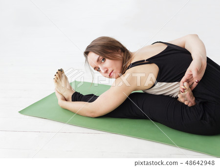 Seated forward bend. Seated forward bend. 48642948