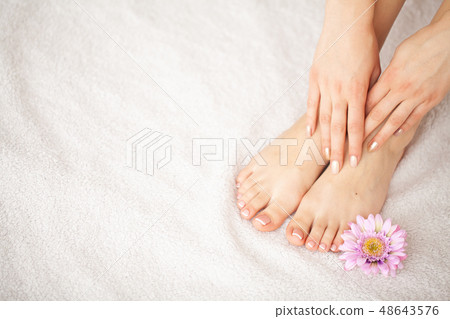 Hand and Nail Care. Beautiful Women's Feet and Hands After Manicure and Pedicure at Beauty Salon 48643576
