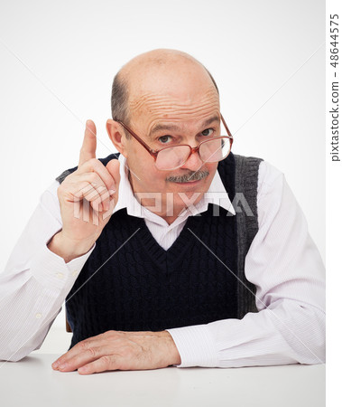 elderly bald man gives advice about life. elderly bald man gives advice about life. 48644575