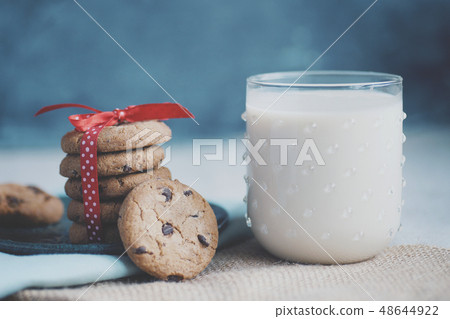Stack of Chocolate chip cookie and glass of milk.. Stack of Chocolate chip cookie and glass of milk.. 48644922