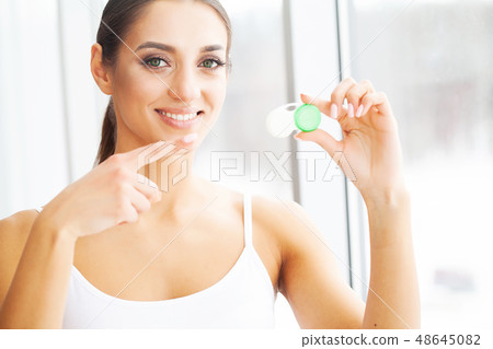 Health and Beauty. Eye Care. Beautiful Young Woman Holding Drops For Eyes. Good Vision. Happy Girl 48645082