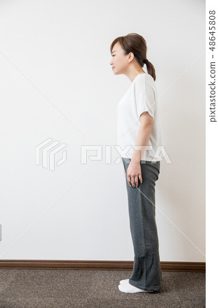 Woman with bad posture (stoop back) 48645808