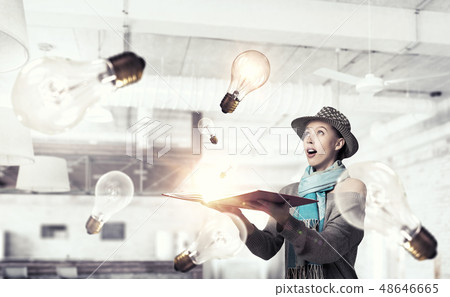 Student girl with book in hands Student girl with book in hands 48646665