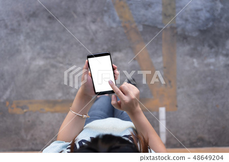 Woman using tablet Mockup for your own content at Woman using tablet Mockup for your own content at 48649204