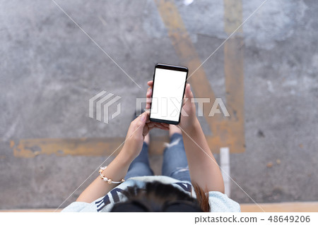 Woman using tablet Mockup for your own content at Woman using tablet Mockup for your own content at 48649206